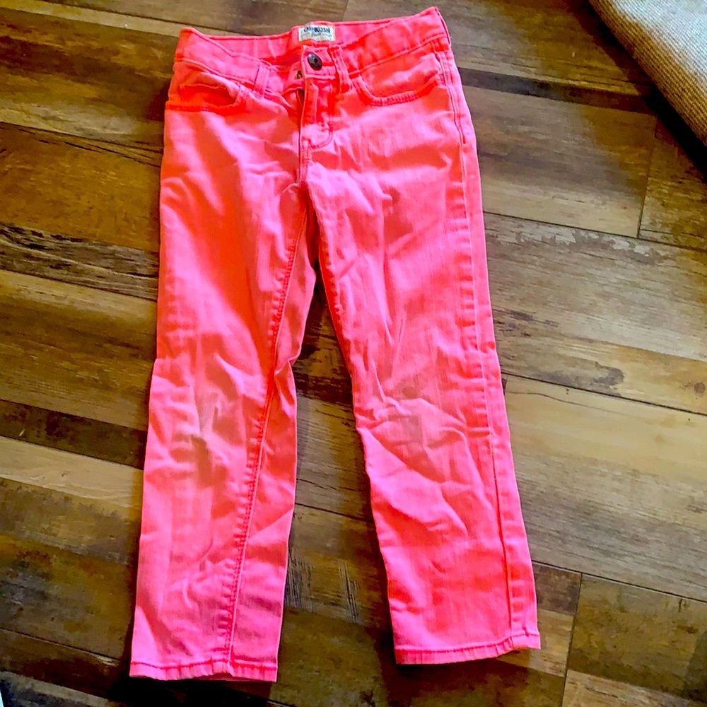 Little worn on the knees, coral skinny jeans